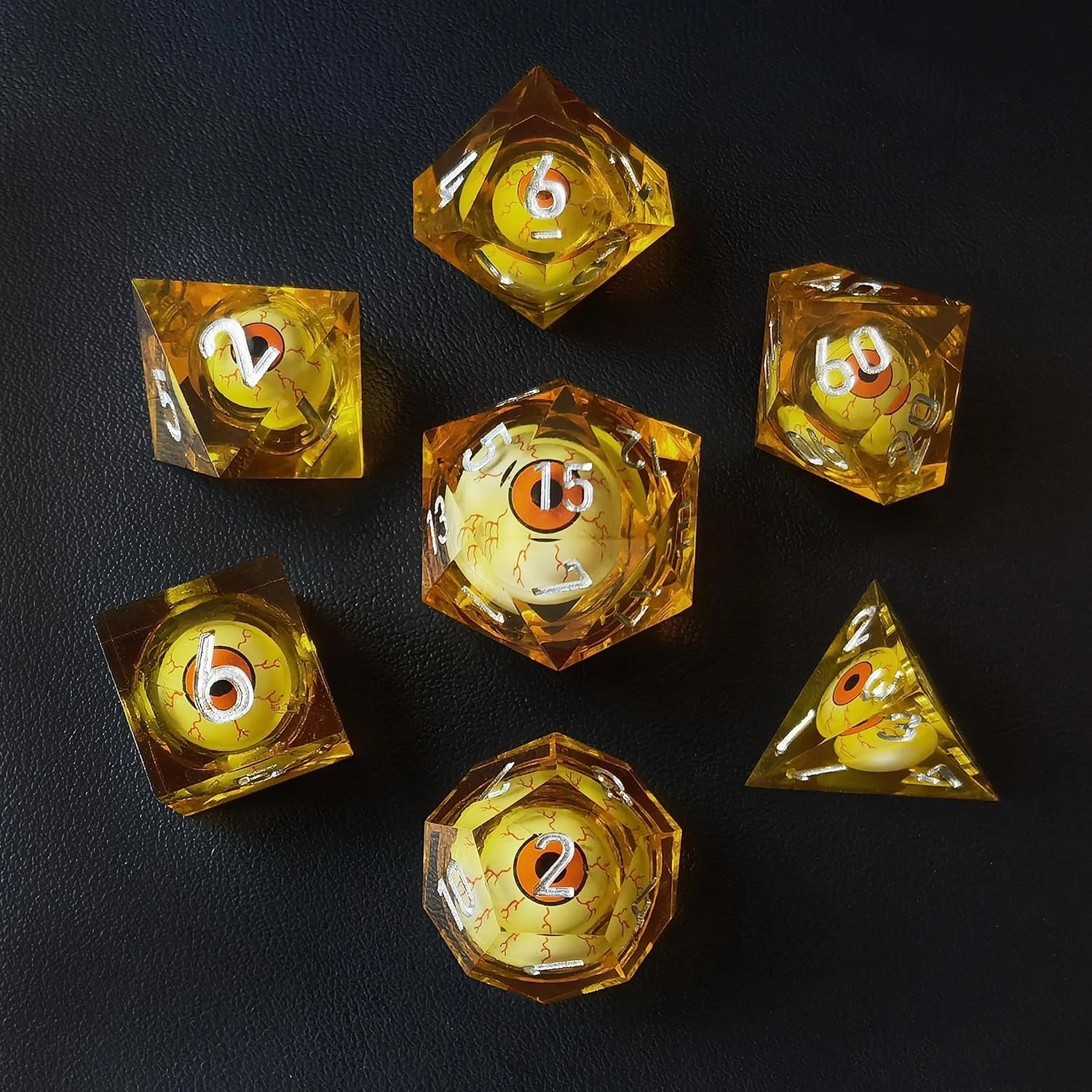 BESCON Sharp Edged Liquid Core Rolling Eyeball Polyhedral Dice Set - Razor Edge Polyhedral Dice with Rolling Eyeball Inside (7pcs Amber RPG Dice Set with Orange Eye)