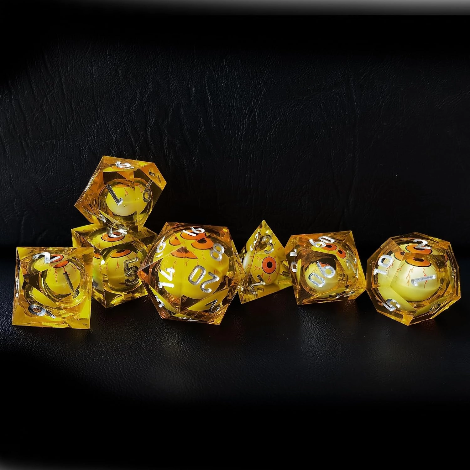 BESCON Sharp Edged Liquid Core Rolling Eyeball Polyhedral Dice Set - Razor Edge Polyhedral Dice with Rolling Eyeball Inside (7pcs Amber RPG Dice Set with Orange Eye)